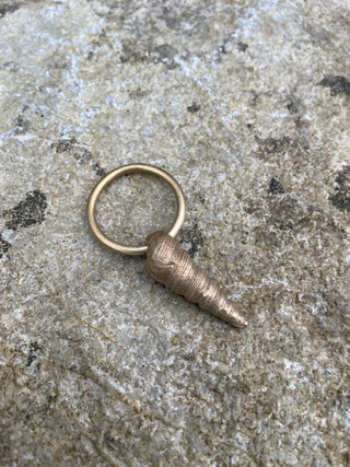 Auger Shell Charm.